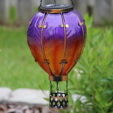 Load image into Gallery viewer, Hot Air Balloon Hanging Solar Lantern Large - Purple in a backyard grass setting.
