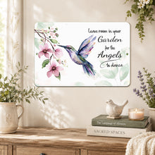 Load image into Gallery viewer, Inspirational hummingbird angel metal sign styled in a soft neutral indoor setting with floral accents