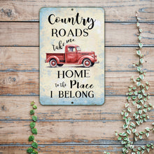 Load image into Gallery viewer, Country Roads Take Me Home Metal Sign by Dyenamic Art featuring a vintage red pickup truck with rustic typography on a distressed background.
