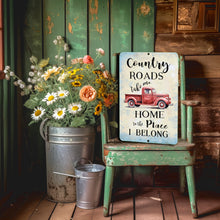 Load image into Gallery viewer, Country Roads Take Me Home Metal Sign by Dyenamic Art featuring a vintage red pickup truck with rustic typography on a distressed background.
