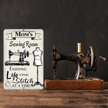 Load image into Gallery viewer, Dyenamic Art Personalized Sewing Room Metal Sign displayed beside an antique sewing machine, adding nostalgic charm to the space.
