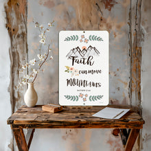 Load image into Gallery viewer, Faith Can Move Mountains Metal Sign by Dyenamic Art featuring a hand-drawn mountain scene, floral accents, and Matthew 17:20 scripture. Made in the USA.
