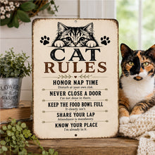 Load image into Gallery viewer, Cat Rules farmhouse metal sign displayed beside a calico cat in a cozy home with rustic cottage décor.
