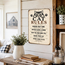 Load image into Gallery viewer, Funny Cat Rules metal wall sign hanging in a modern farmhouse living room with rustic home décor.
