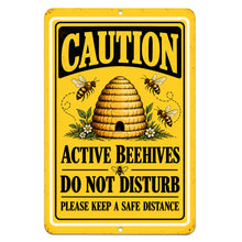 Load image into Gallery viewer, Yellow and black Active Beehives caution metal sign featuring a traditional beehive, flying honeybees, and Do Not Disturb warning lettering on a white background.

