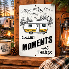 Load image into Gallery viewer, Collect Moments Not Things camping sign displayed at cozy RV campsite with campfire and lantern
