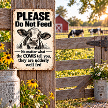 Load image into Gallery viewer, Funny cow metal sign displayed on a rustic farm gate with cows and red barn in the background
