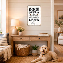 Load image into Gallery viewer, Dogs Do Speak wall sign displayed in a cozy neutral room with a dog resting nearby
