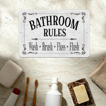 Load image into Gallery viewer, Classic Bathroom Rules Metal Sign displayed in a contemporary bathroom setting, complementing modern decor with its clean and minimalist aesthetic.
