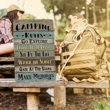 Load image into Gallery viewer, Camping Rules Metal Sign displayed on a weathered wooden background, creating a cozy and rustic lodge or camper-inspired setting.
