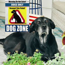 Load image into Gallery viewer, Dog Zone Metal Sign Displayed Outdoors behind black lad dog – Ideal for Pet Owners and Dog-Friendly Spaces.
