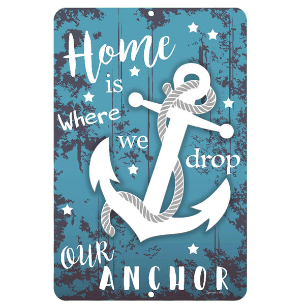 Dyenamic Art 'Home is Where We Drop Our Anchor' metal sign featuring a bold white anchor with rope on a distressed blue wood-style background. A perfect nautical home decor piece.