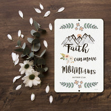 Load image into Gallery viewer, Detailed view of Faith Can Move Mountains Metal Sign, highlighting the intricate floral design and elegant typography.
