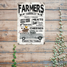 Load image into Gallery viewer, Farmhouse-style metal sign displayed on a rustic wooden wall with trailing greenery, enhancing country kitchen aesthetics and vintage home decor charm.
