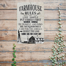 Load image into Gallery viewer, Farmhouse Rules metal sign displayed on a distressed wooden surface, bringing warmth and character to country kitchens, barns, and farm-style homes.
