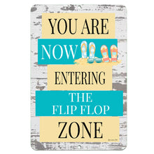 Load image into Gallery viewer, Dyenamic Art 'Flip Flop Zone' metal sign featuring a rustic beach-inspired design with colorful flip-flops, set against a distressed wood background. A fun and welcoming decor piece.
