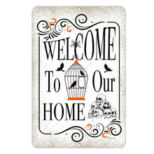 Load image into Gallery viewer, Dyenamic Art Halloween Welcome Home Metal Sign – Spooky and stylish Halloween décor featuring vintage typography, a birdcage with ravens, skulls, and swirled accents.
