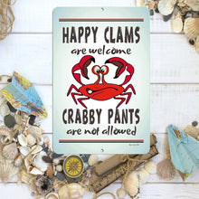 Load image into Gallery viewer, Dyenamic Art 'Happy Clams' metal sign placed among seashells and nautical-themed decor, enhancing its beachy and humorous appeal.
