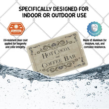 Load image into Gallery viewer, Hot Cocoa &amp; Coffee Bar Metal Sign featured with water splashing around it, demonstrating its waterproof, rust-resistant, and UV-protected coating for long-lasting durability indoors and outdoors.
