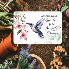 Load image into Gallery viewer, Hummingbird Metal Sign surrounded by flowers and garden elements, bringing serenity to any environment.
