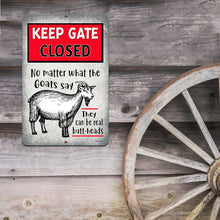 Load image into Gallery viewer, Keep Gate Closed Goat sign displayed on a barn wall beside a vintage wagon wheel, blending humor with rustic country charm.
