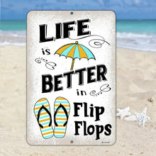 Load image into Gallery viewer, Life is Better in Flip Flops metal sign with striped flip-flops, beach umbrella, and distressed white background. Perfect for beach decor.
