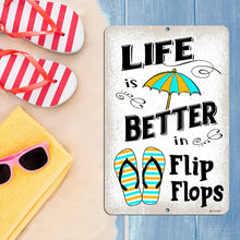 Load image into Gallery viewer, Dyenamic Art &#39;Life is Better in Flip Flops&#39; sign displayed on a sandy beach with starfish, creating a relaxed and coastal atmosphere perfect for summer homes and poolside decor.
