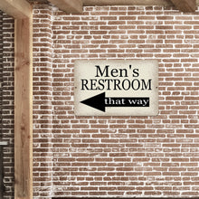 Load image into Gallery viewer, Men’s Restroom Left-Pointing Arrow Sign displayed on an exposed brick wall, enhancing commercial and public restroom signage with a classic look.
