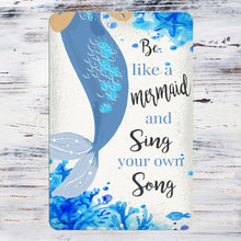 Load image into Gallery viewer, Dyenamic Art 'Be Like a Mermaid and Sing Your Own Song' sign displayed on a rustic whitewashed wooden background, adding a touch of nautical charm.

