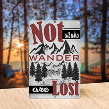 Load image into Gallery viewer, Decorative metal sign displayed outdoors with a rustic mountain landscape and inspirational travel quote, ideal for home or cabin decor.
