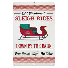 Load image into Gallery viewer, Dyenamic Art Old Fashioned Sleigh Rides Metal Sign – A vintage-inspired Christmas wall sign featuring a red sleigh with green seats, decorative text, and a snowy holiday background.
