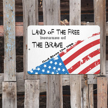 Load image into Gallery viewer, God Bless America Metal Sign – Displayed in a Festive Patriotic Setting Alongside Red, White, and Blue Decor, Perfect for Celebrating National Pride.
