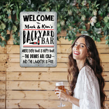 Load image into Gallery viewer, A stylish Backyard Bar Sign mounted on a wooden wall with lush greenery, complementing a social setting where friends gather for drinks and laughter.
