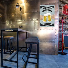 Load image into Gallery viewer, A lifestyle image of a personalized man cave metal sign displayed in a home bar with an industrial-style interior.
