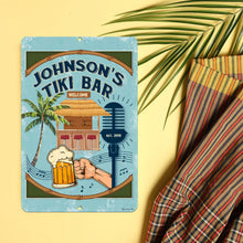 Load image into Gallery viewer, Tiki Bar Metal Sign featuring a tropical design with a thatched hut, palm tree, and beer mug, perfect for beachside decor.
