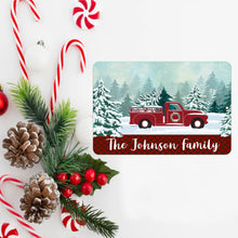 Load image into Gallery viewer, Personalized Red Truck Metal Sign surrounded by candy canes, pinecones, and festive greenery for a cozy Christmas feel.
