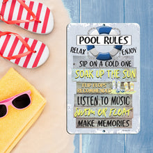 Load image into Gallery viewer, Dyenamic Art Pool Rules Metal Sign styled on a blue wooden surface alongside summer essentials like red-and-white flip-flops, a yellow towel, and pink sunglasses. Perfect for beach and pool decor.
