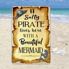 Load image into Gallery viewer, Close-up of Dyenamic Art Salty Pirate Lives with a Beautiful Mermaid Metal Sign showcasing rustic burnt parchment effect and bold typography for a maritime theme.
