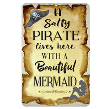 Load image into Gallery viewer, Dyenamic Art Salty Pirate Lives with a Beautiful Mermaid Metal Sign – vintage parchment background with pirate hat and mermaid silhouette, ideal for nautical home decor.
