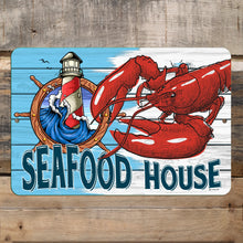 Load image into Gallery viewer, Seafood House Metal Sign mounted on a rustic wooden backdrop, adding a vintage maritime charm to coastal restaurants, seafood shacks, and nautical-themed spaces.
