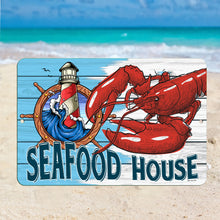 Load image into Gallery viewer, Vibrant Seafood House Sign displayed on a sandy beach with turquoise ocean waves in the background, enhancing the coastal ambiance of beachside cafes and summer homes.
