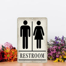Load image into Gallery viewer, Minimalist Unisex Restroom Sign positioned against a backdrop of colorful flowers, adding a touch of elegance to an otherwise functional bathroom sign.
