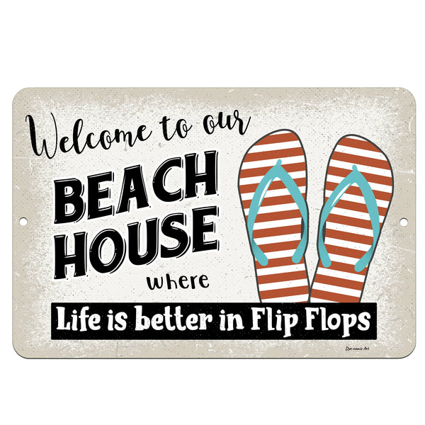 Dyenamic Art Welcome to Our Beach House Metal Sign – Coastal wall decor featuring striped flip flops and beach-inspired typography on a distressed background for a relaxed, seaside vibe.
