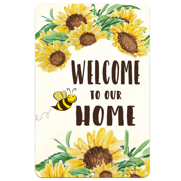 The Dyenamic Art Welcome to Our Home metal sign featuring vibrant watercolor sunflowers, a playful bee illustration, and a welcoming message, perfect for farmhouse and garden decor.