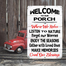 Load image into Gallery viewer, A close-up of the Dyenamic Art Welcome to Our Porch metal sign, highlighting its classic black typography, red script, and distressed white wood background.
