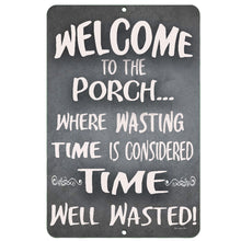Load image into Gallery viewer, The Dyenamic Art Welcome to Our Porch metal sign featuring a classic chalkboard-style design with a humorous quote about wasting time on the porch.
