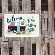 Load image into Gallery viewer, Welcome to Our Rolling Estate Metal Sign displayed on a rustic wooden background – Perfect for RVers and dog lovers.
