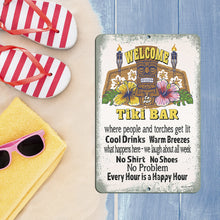 Load image into Gallery viewer, Tiki Bar Metal Sign displayed on a beachside table with flip-flops, sunglasses, and a tropical setting, adding a fun island vibe to any space.
