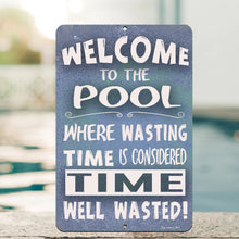 Load image into Gallery viewer, Detailed close-up of the Dyenamic Art Welcome to the Pool Metal Sign, showcasing the high-resolution print, bold lettering, and vibrant blue background. A stylish poolside decor piece.
