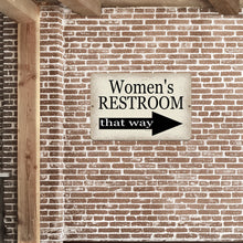 Load image into Gallery viewer, Elegant restroom wayfinding sign with a right-pointing arrow mounted on a vintage-style brick wall, great for modern and industrial spaces.
